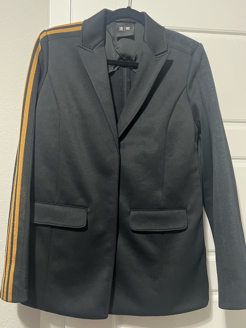 Adidas Black Blazer with Contrasting Gold Shoulder Stripes.